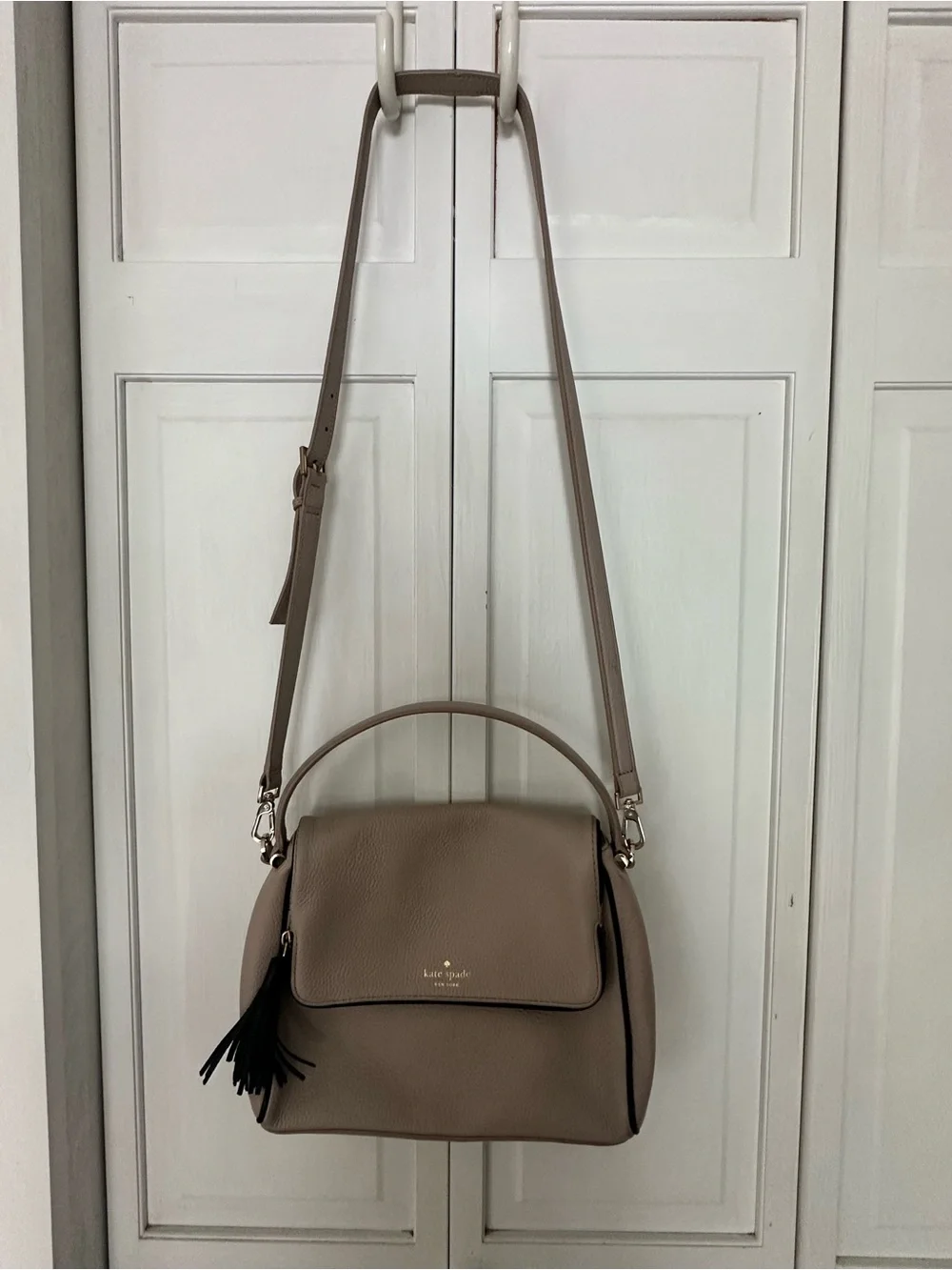 kate spade taupe pebbled leather shoulder bag with black tassel